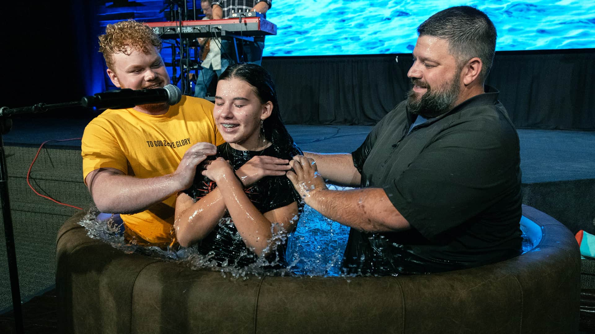 A teenage girl being baptised at the Youth Ministry at North Way Christian Community's Robinson church campus.