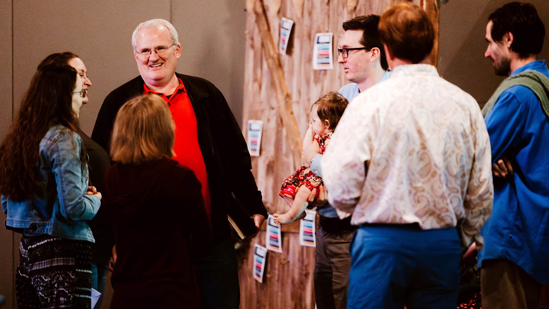An image of woman praying at North Way Robinson