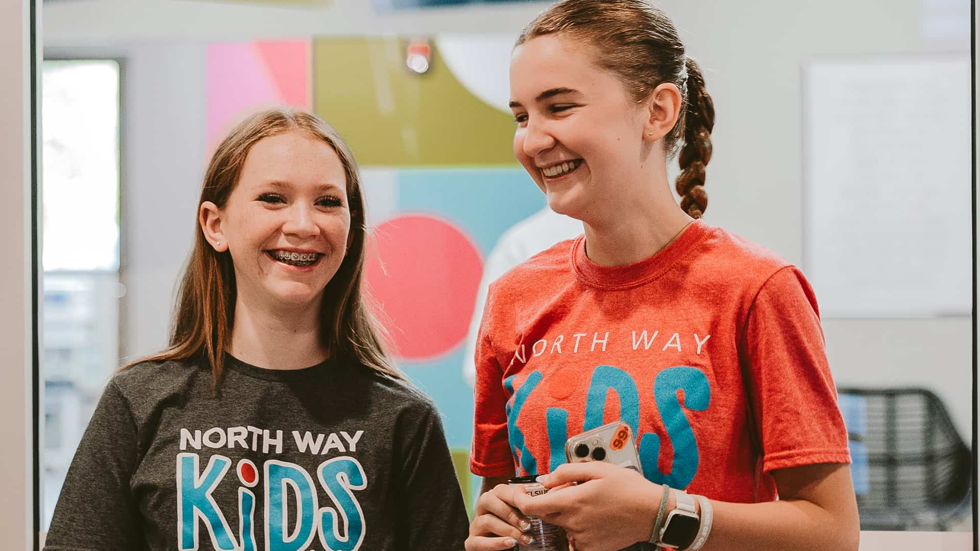 Two laughing teenagers in our church's Student Ministry in Beaver Valley, PA