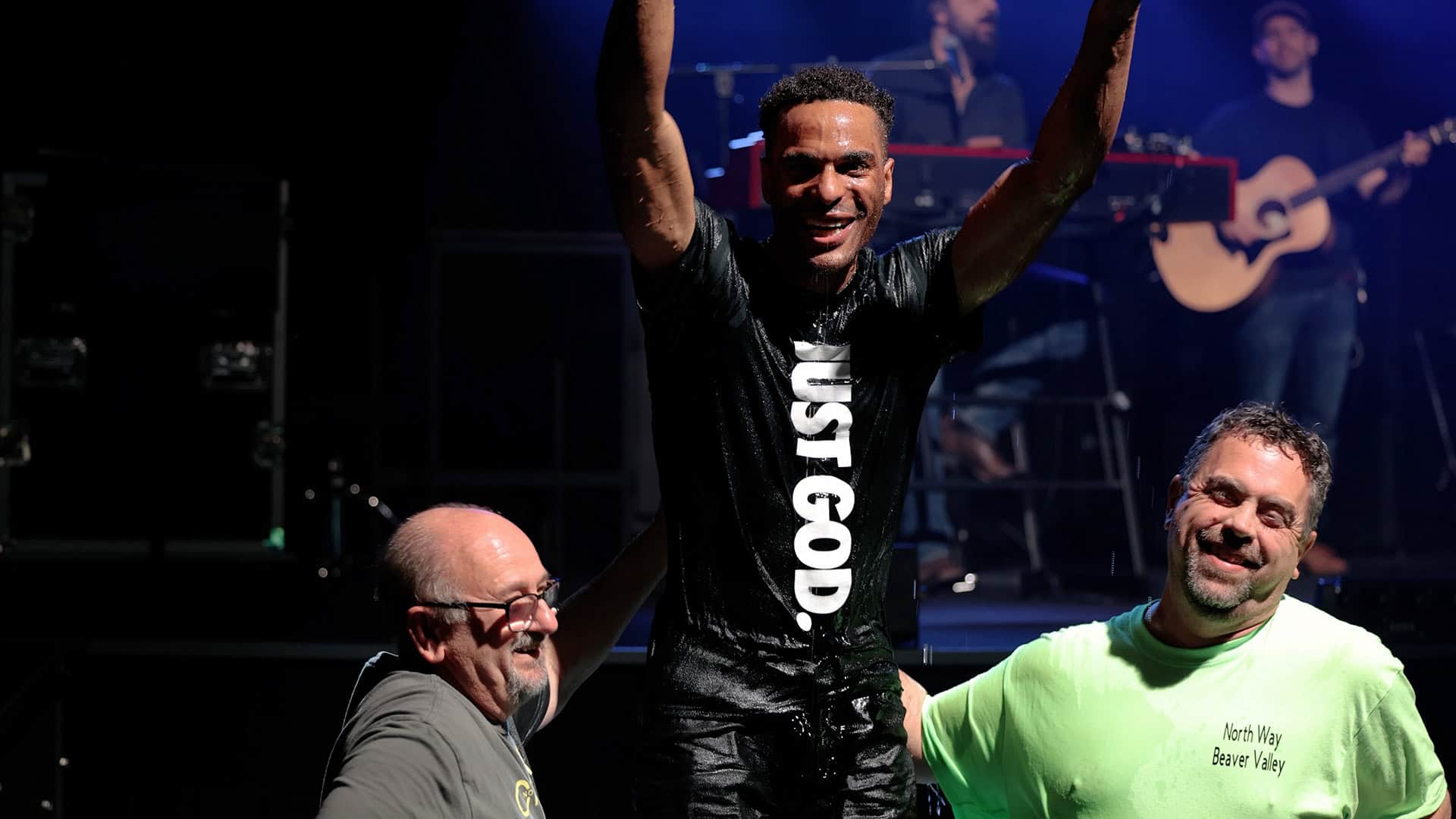 Man emerging from water after being baptized