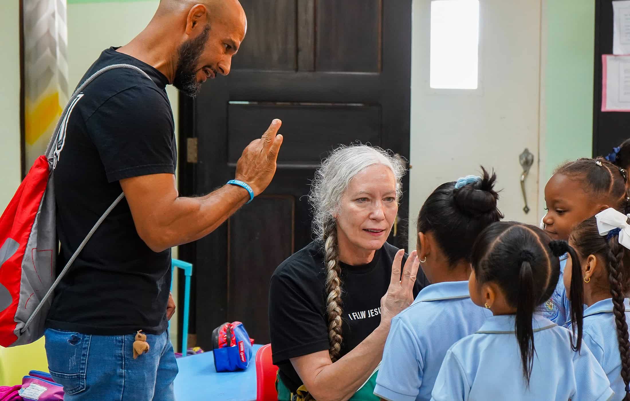 North Way mission trip members teaching children to count