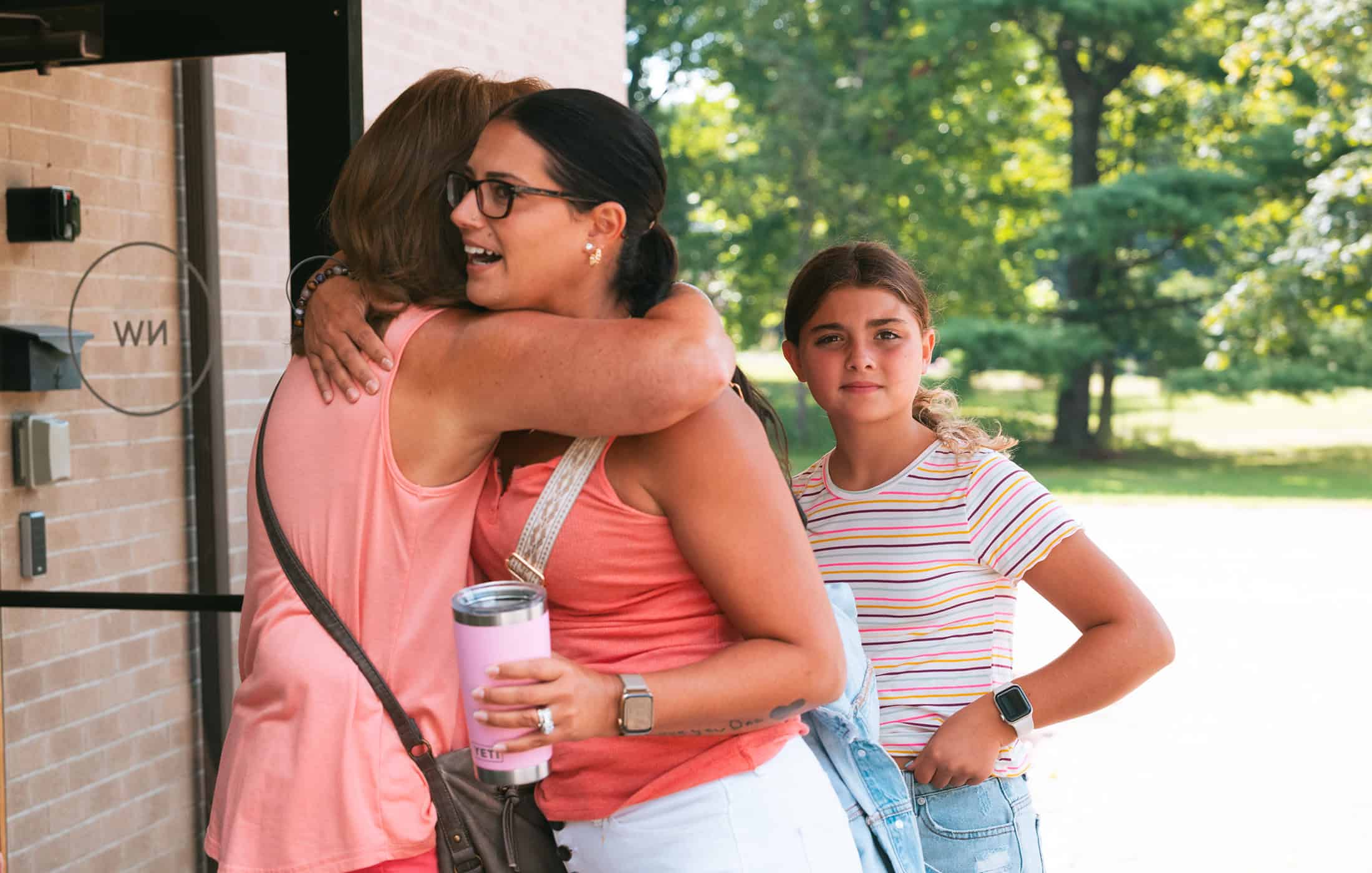 A woman being greeting by a North Way volunteer at the South Hills campus, a nondenominational church in Pittsburgh PA