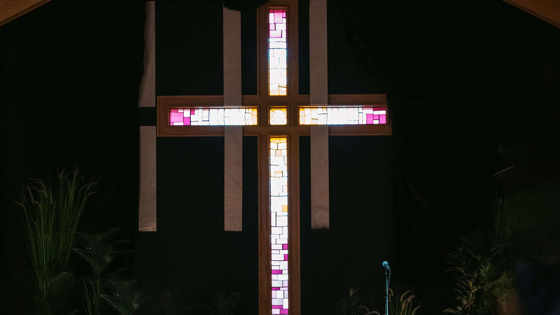 A lit cross in the North Way South Hills sanctuary