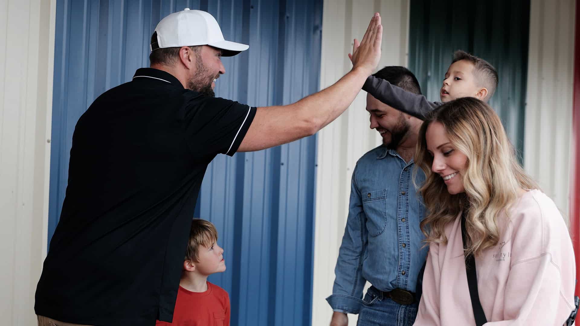 Jordan Kepner, North Way Hermitage Campus Lead, greeting a family at the Olympic Fun Center