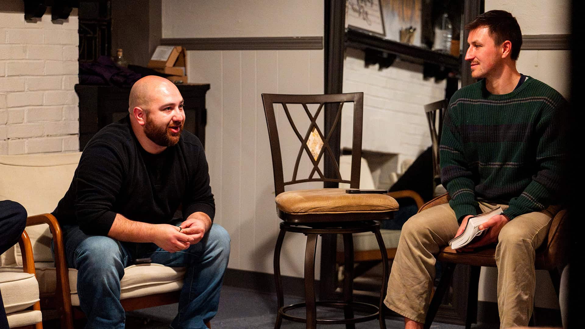 Student Ministry Director teaching high school boys in a small group