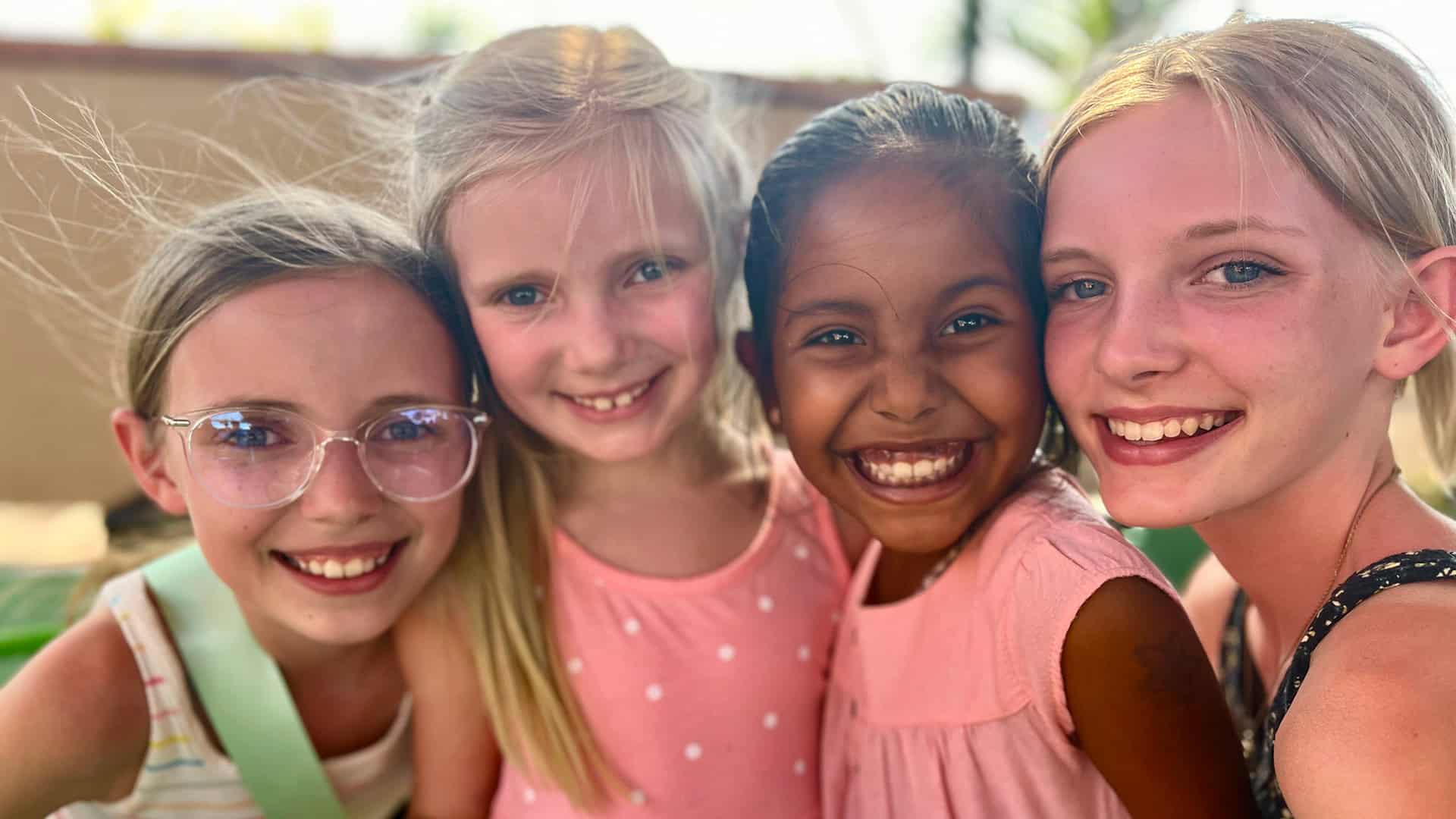 Young girls smiling for a photo