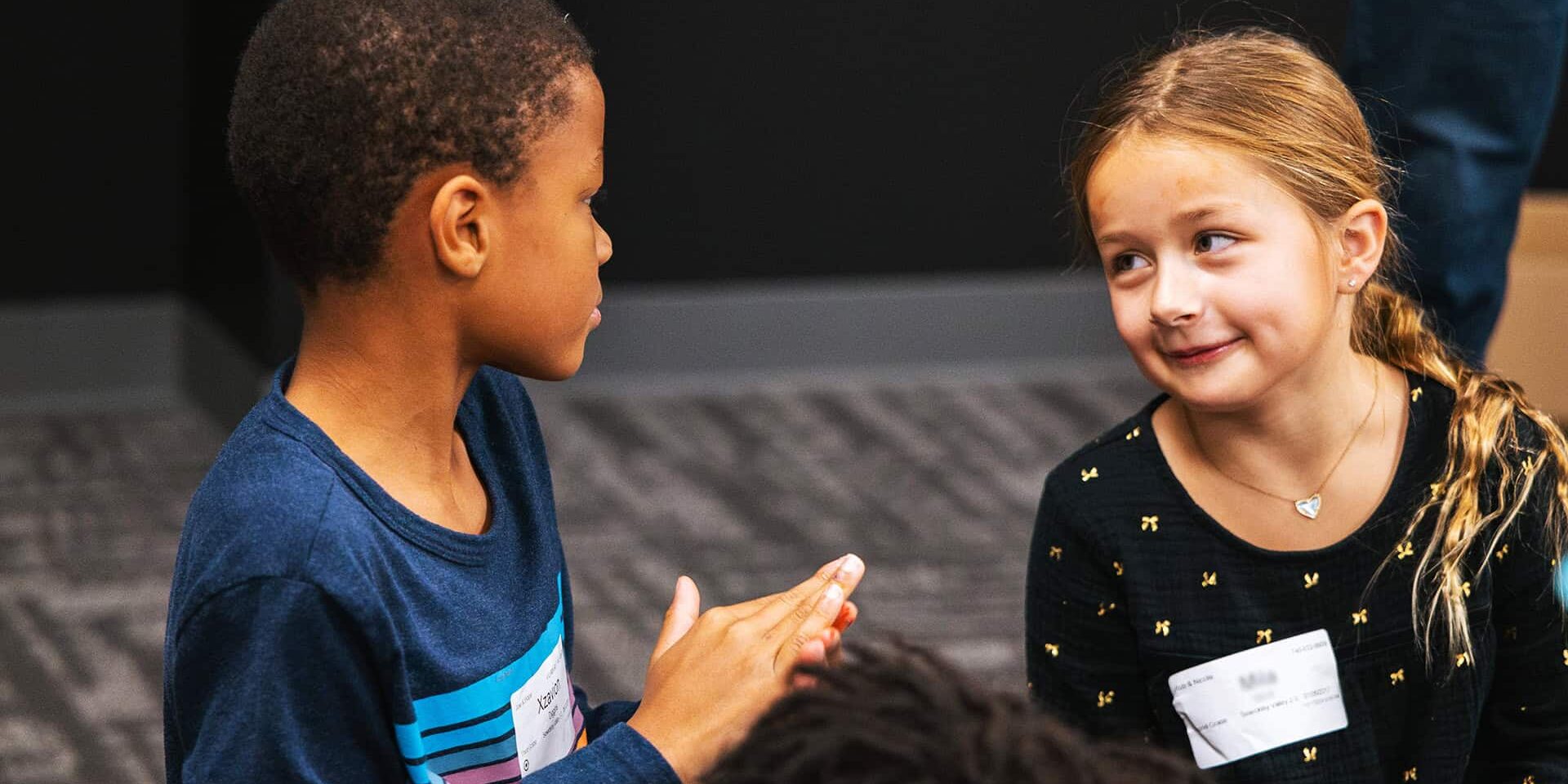 Two kids conversing at NW Kids Sewickley Valley