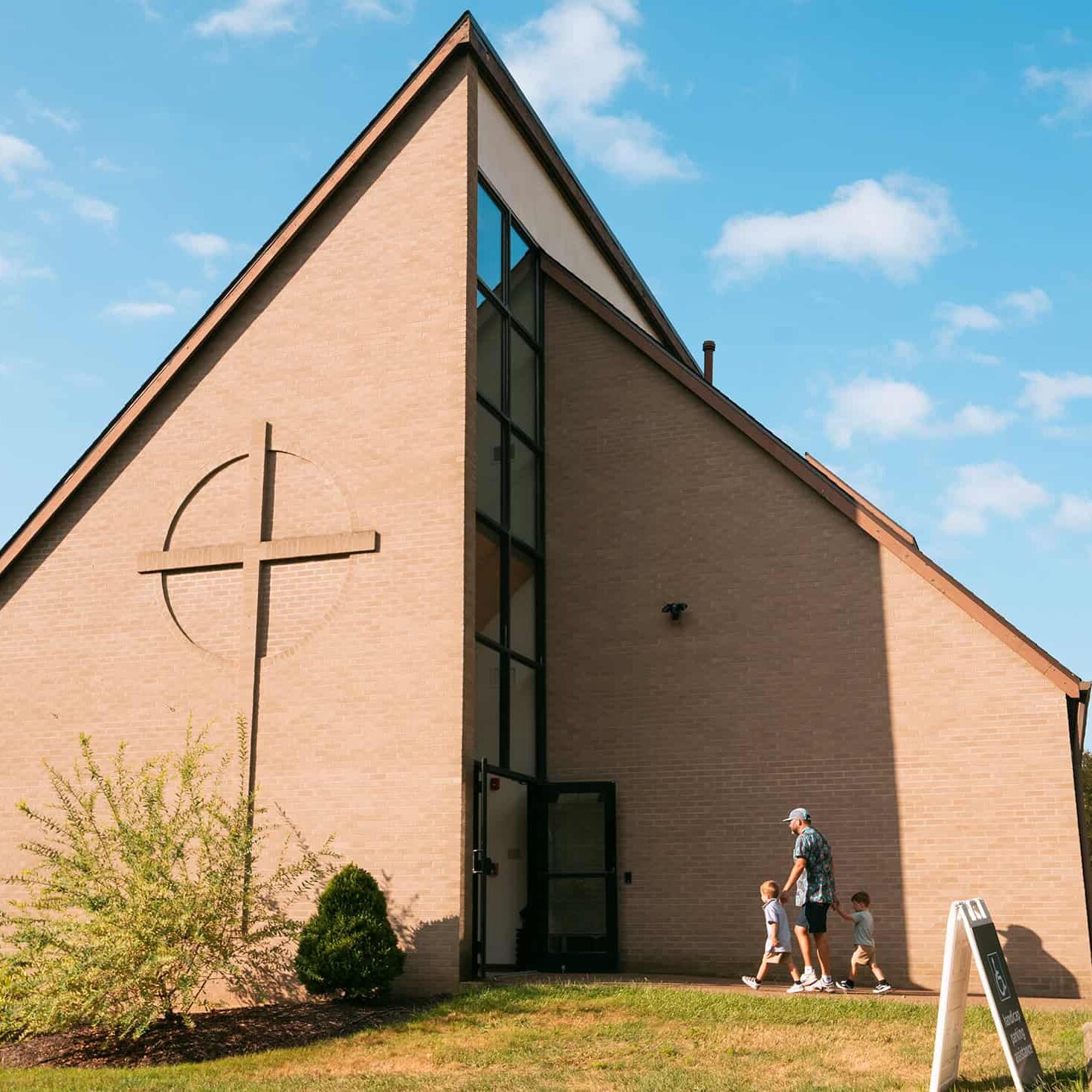 A family entering the South Hills Campus building