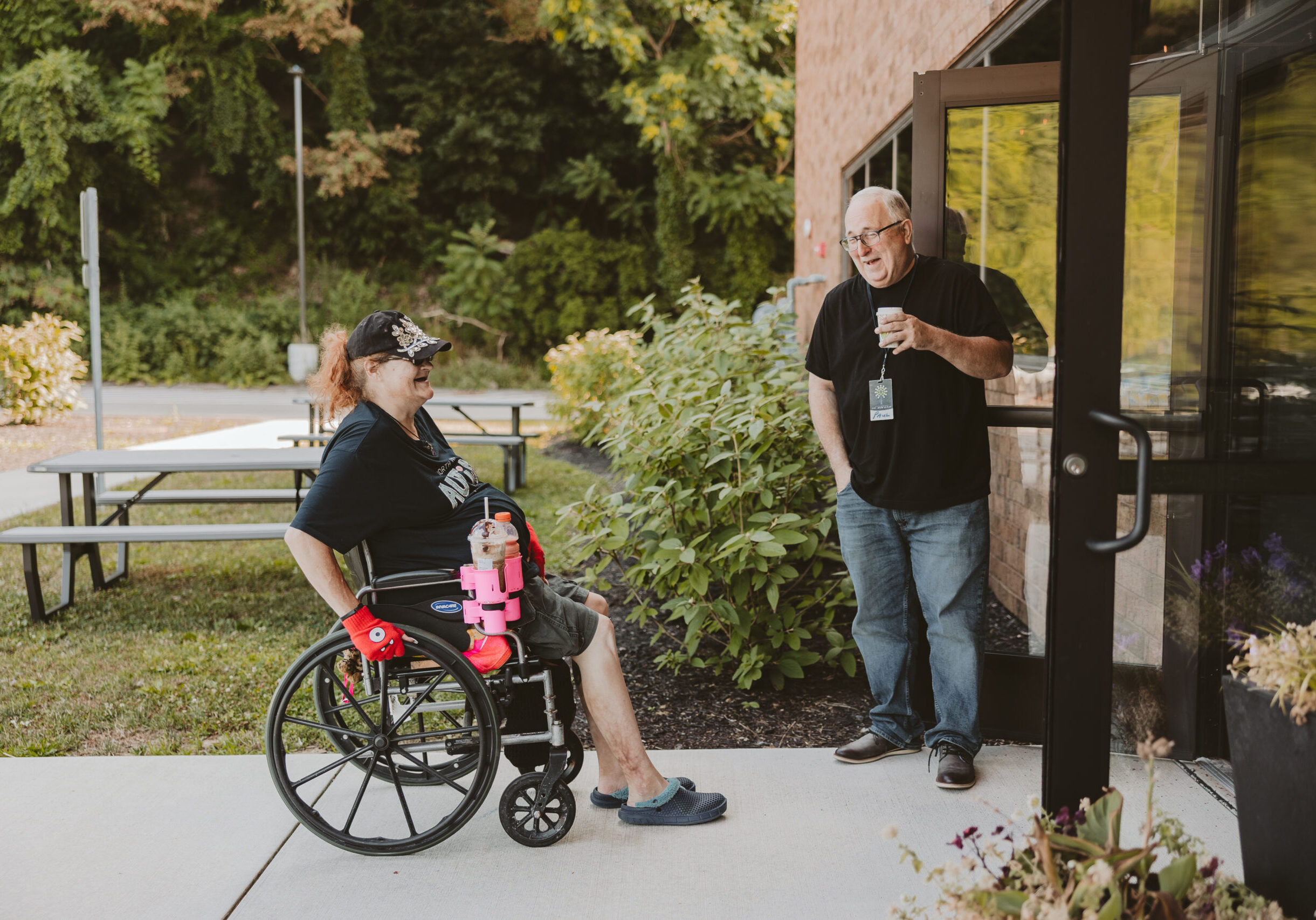 Image of a man greeting at the entrance to a church in Sewickley