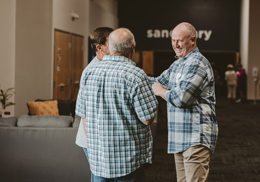 Image of men talking at North Way Christian Community, a church in Beaver