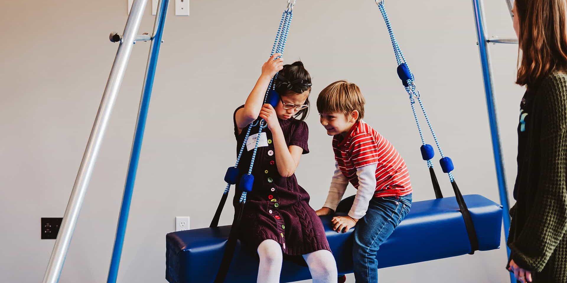 Children on a swing at North Way Sewickley Valley Autism Ministry