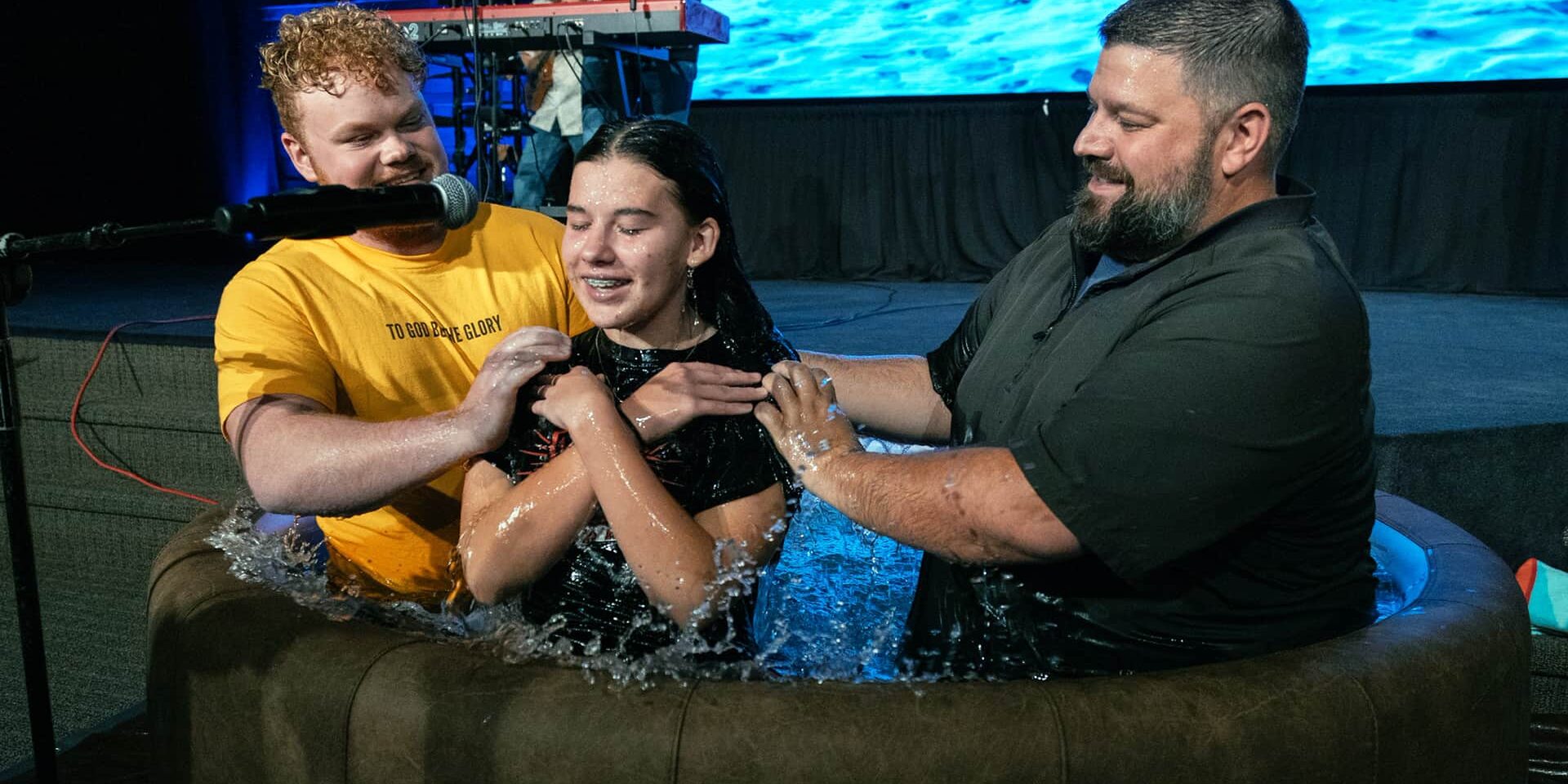 A teenage girl being baptised at the Youth Ministry at North Way Christian Community's Robinson church campus.