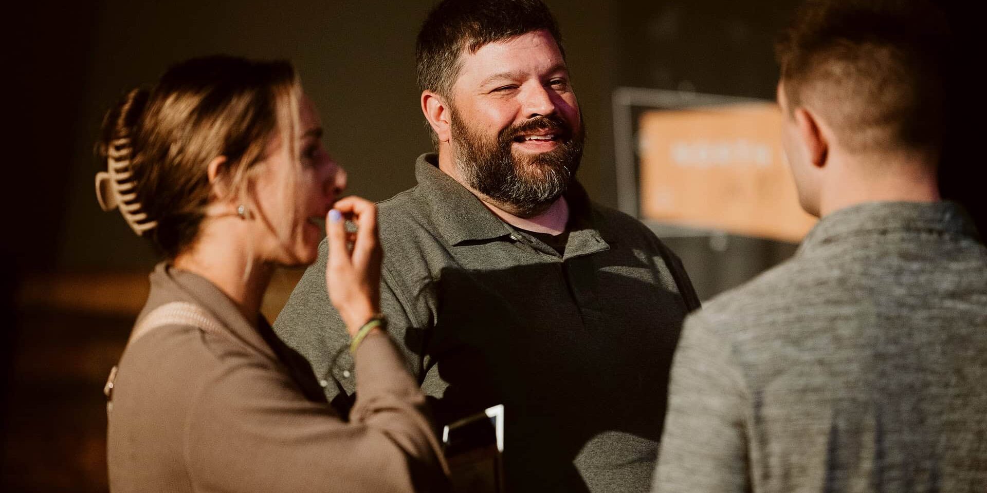 Pastor Sean Kelly conversing with people before a Sunday morning worship service at North Way's Robinson, PA church campus